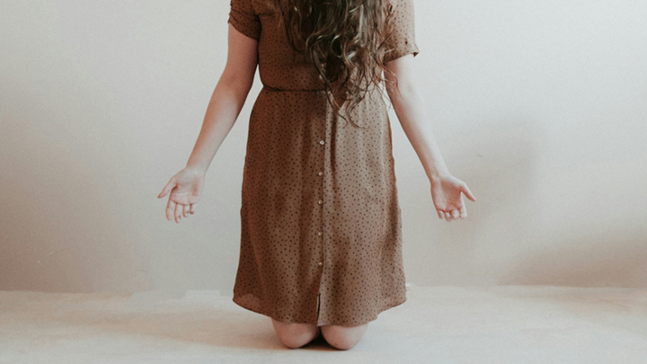 Woman On Knees Praying